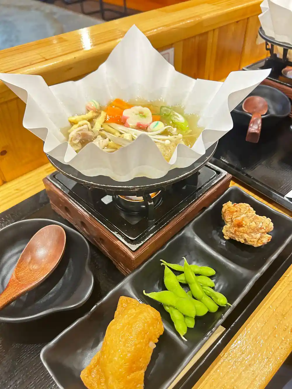 Japanese hot pot dish with vegetables and broth served